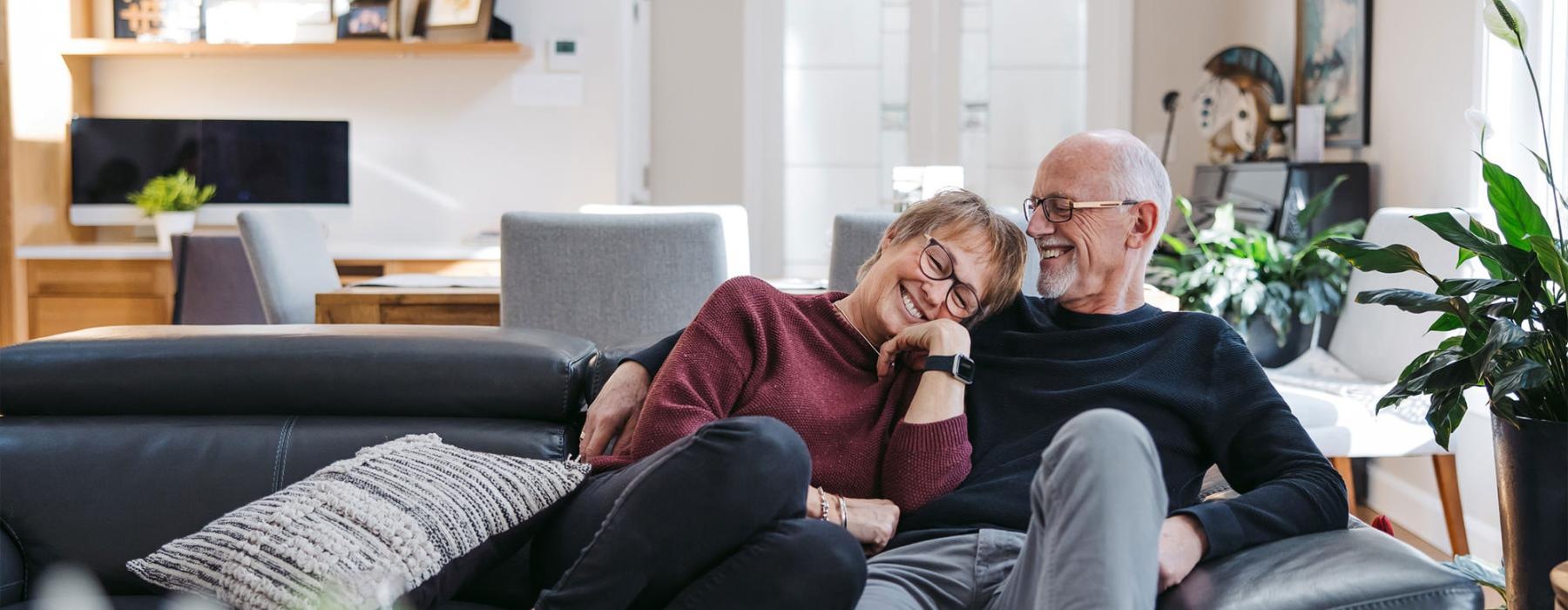 a man and woman sitting on a couch